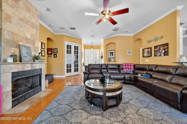 a living room with furniture and a fireplace