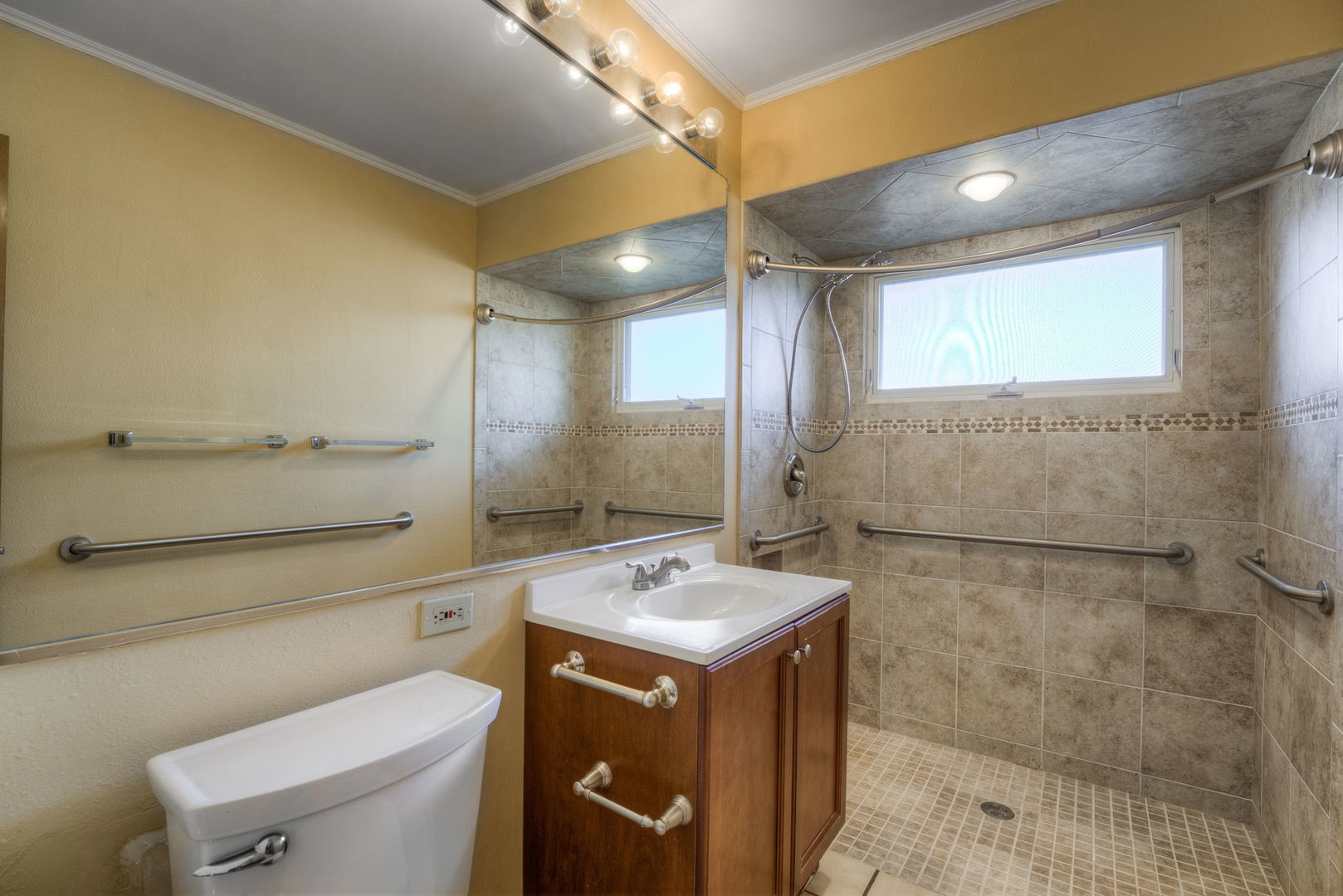 1046 Midway Road Northbrook, IL 60062 - Photo 12 of 24 a bathroom with a sink a toilet and mirror
