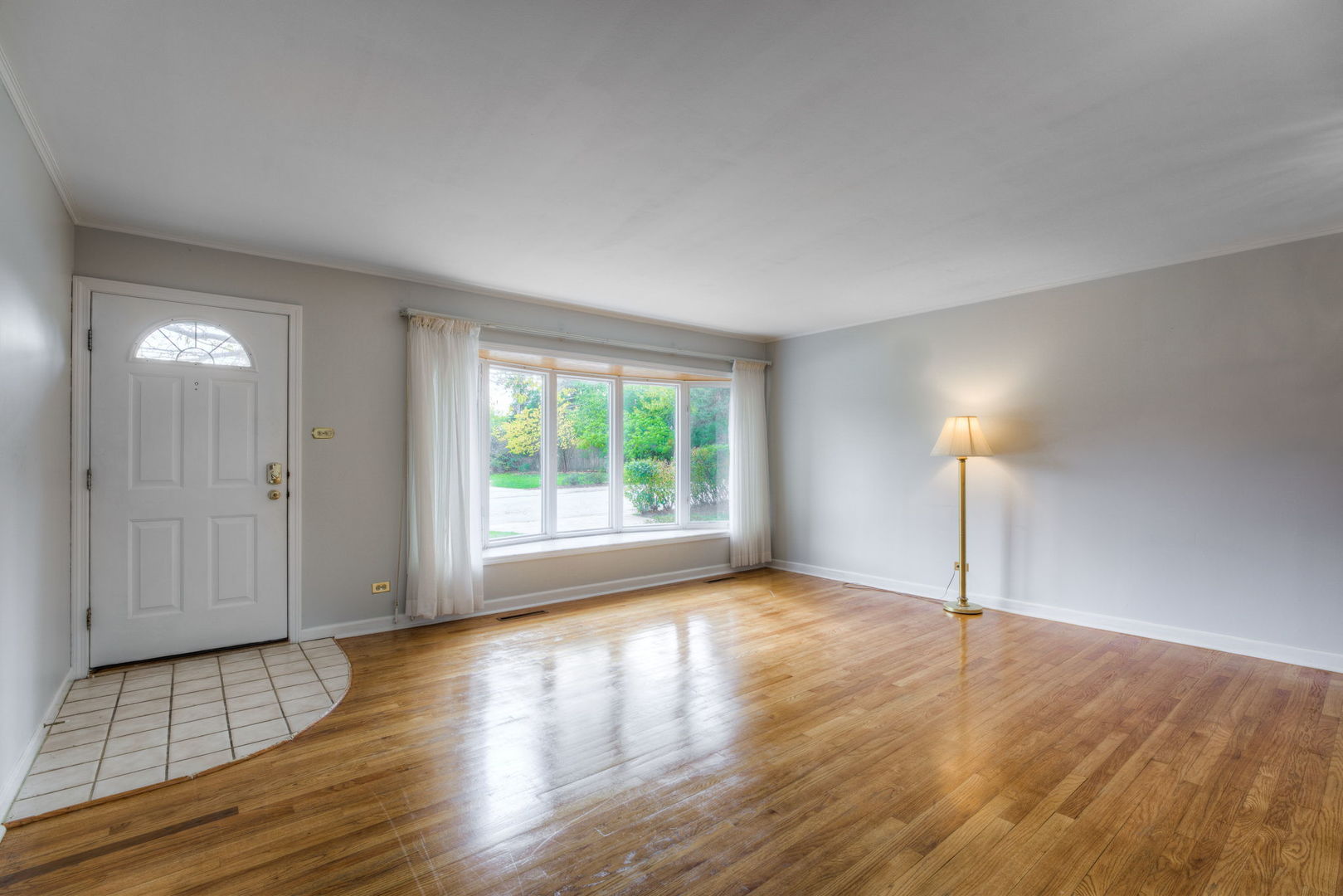 1046 Midway Road Northbrook, IL 60062 - Photo 4 of 24 a view of empty room with wooden floor and fan