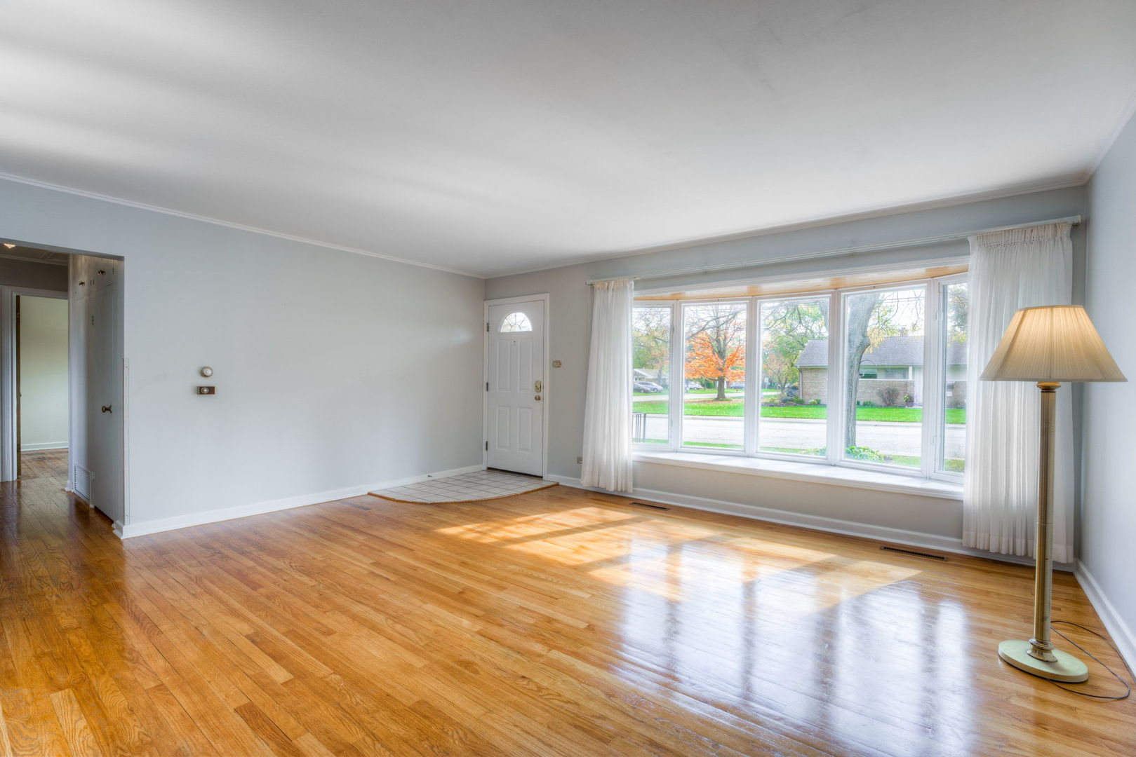 1046 Midway Road Northbrook, IL 60062 - Photo 6 of 24 a view of empty room with wooden floor and fan