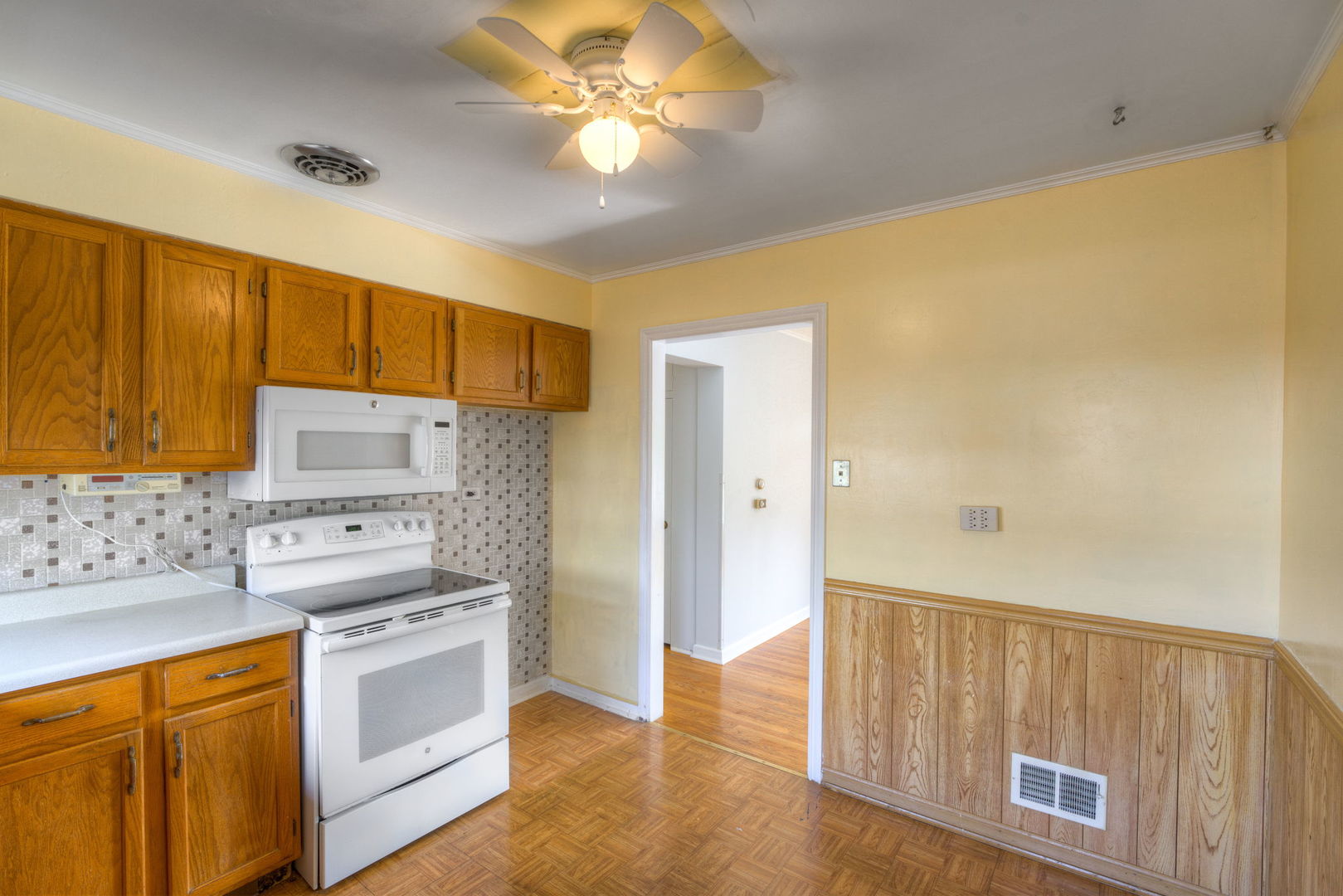 1046 Midway Road Northbrook, IL 60062 - Photo 9 of 24 a kitchen with stainless steel appliances granite countertop a sink a stove a refrigerator cabinets and wooden floor