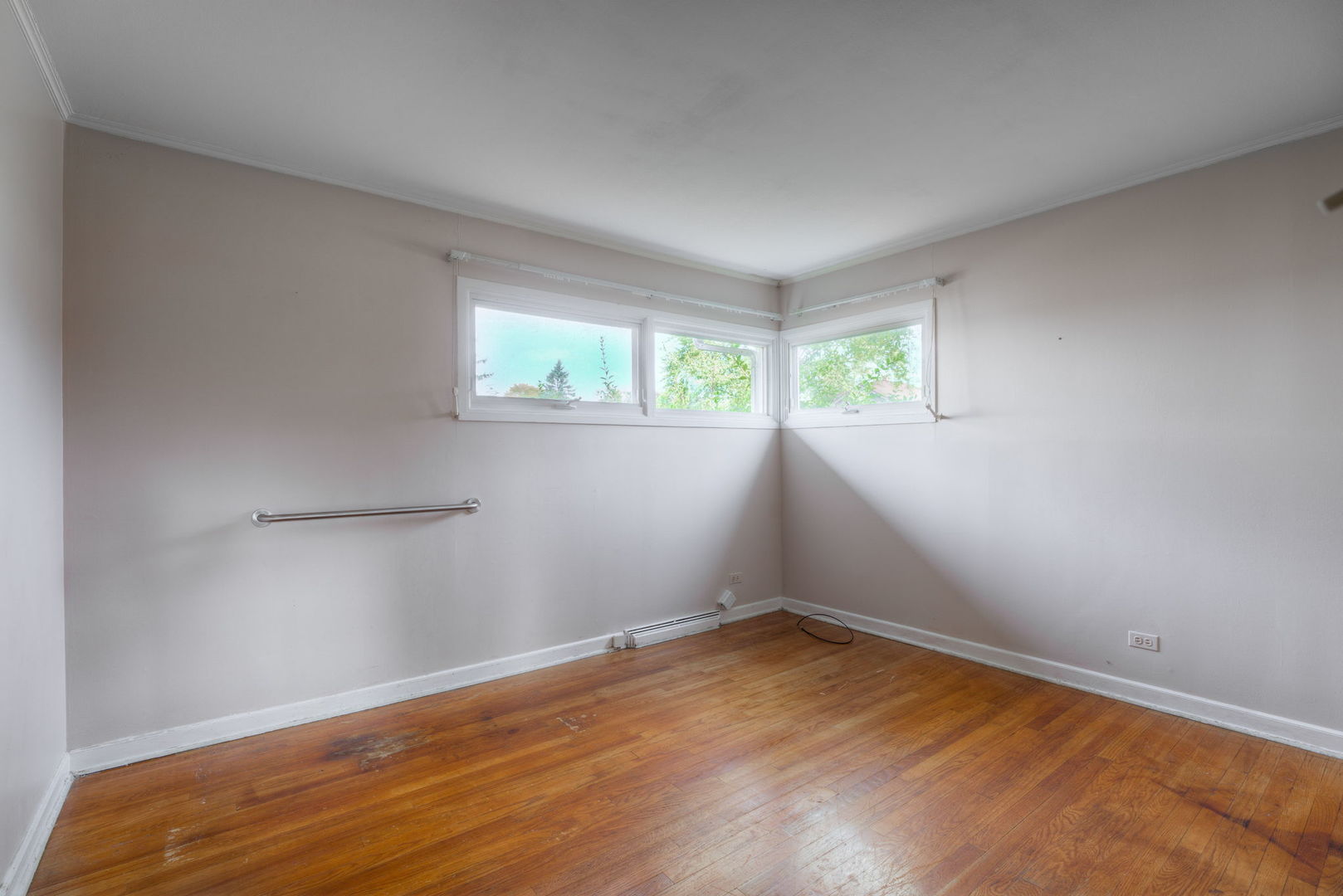 1046 Midway Road Northbrook, IL 60062 - Photo 10 of 24 an empty room with wooden floor and windows
