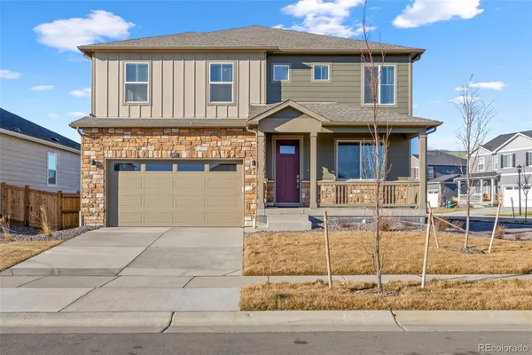 a front view of a house with garage