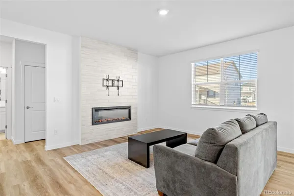 a view of fireplace and wooden floor