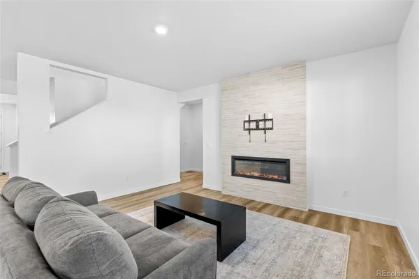 a living room with furniture and a table