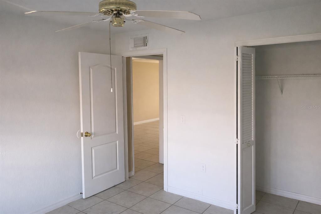 2727 West Oak Ridge Road, Unit 2/ BLDG #7 Orlando, FL 32809 - Photo 11 of 13 wooden floor in an empty room