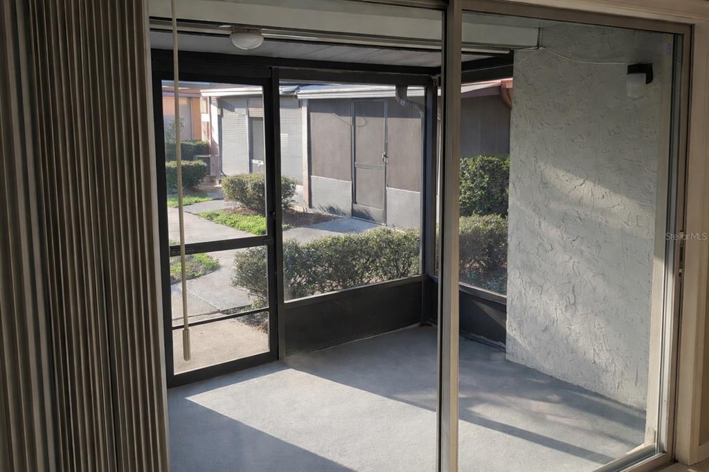 2727 West Oak Ridge Road, Unit 2/ BLDG #7 Orlando, FL 32809 - Photo 12 of 13 a view of a glass door and a living room
