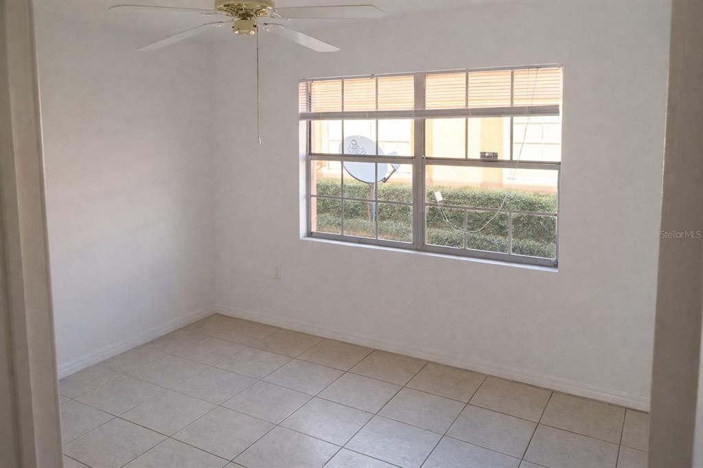 2727 West Oak Ridge Road, Unit 2/ BLDG #7 Orlando, FL 32809 - Photo 7 of 13 an empty room with a window