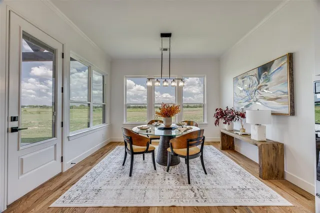 a kitchen with a sink a counter space appliances and cabinets