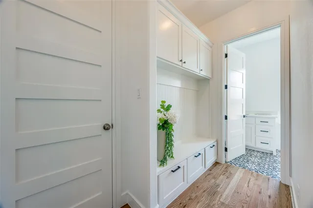 a bedroom with a large bed and a large window