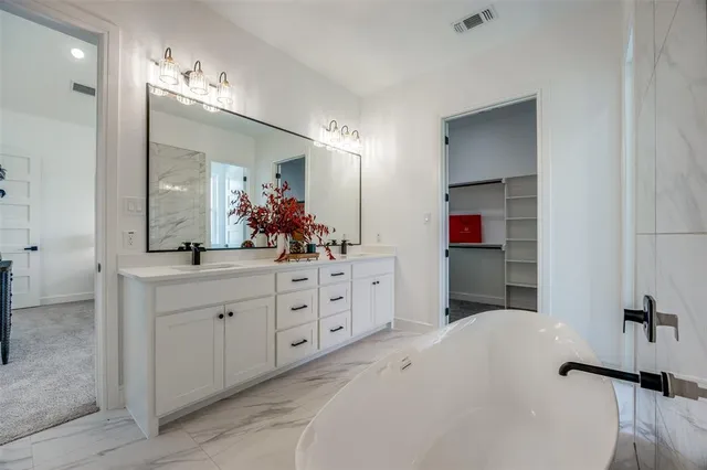 a view of a room with a window and a ceiling fan