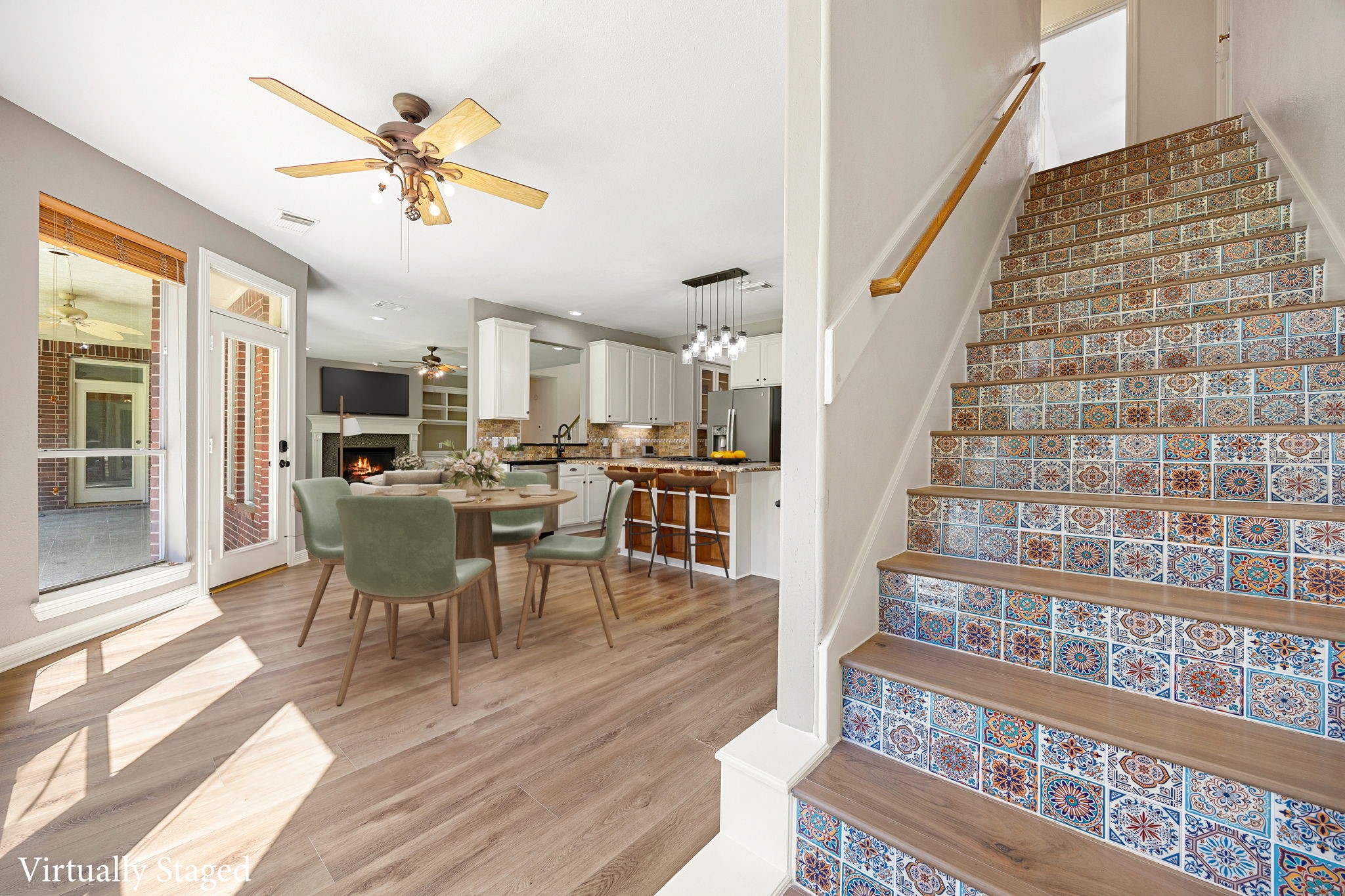 14419 Timbergreen Drive Magnolia, TX 77355 - Photo 42 of 43 Bright open floor plan with views of the kitchen, dining, and living areas, plus a beautifully detailed staircase that adds charm and personality to the space. *virtually staged*