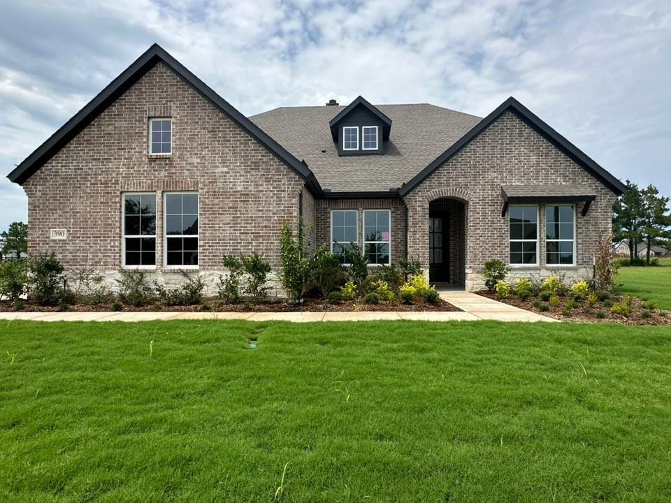 Brick exterior with dark gray trim and white window frames