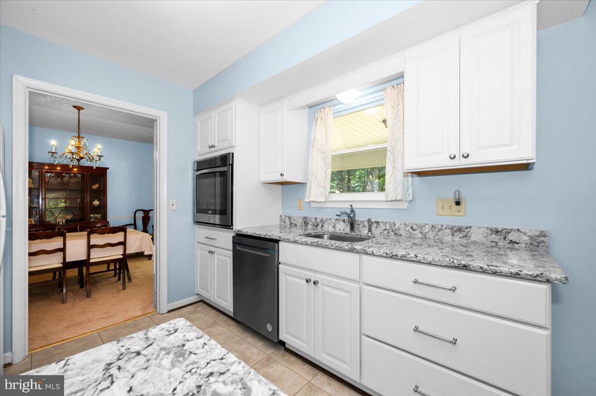 2614 Apple Way Dunkirk, MD 20754 - Photo 12 of 54 a kitchen with a sink stove and cabinets