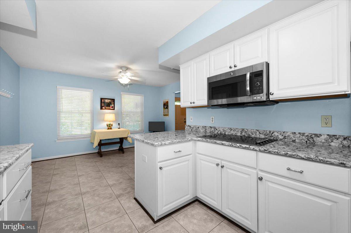 2614 Apple Way Dunkirk, MD 20754 - Photo 13 of 54 a kitchen with stainless steel appliances white cabinets and sink