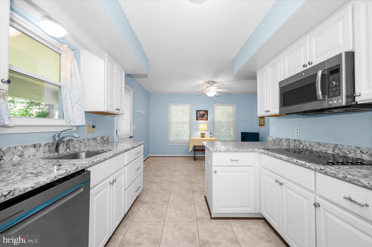 2614 Apple Way Dunkirk, MD 20754 - Photo 14 of 54 a kitchen with a sink stove and microwave