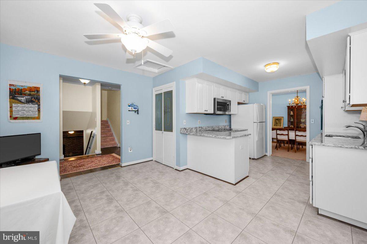 2614 Apple Way Dunkirk, MD 20754 - Photo 18 of 54 a large kitchen with cabinets and stainless steel appliances