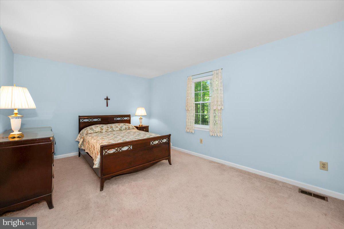 2614 Apple Way Dunkirk, MD 20754 - Photo 19 of 54 a bedroom with a bed and a window