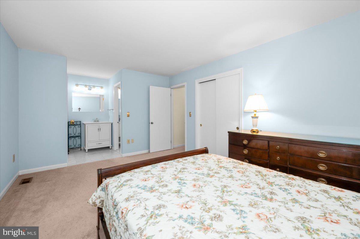 2614 Apple Way Dunkirk, MD 20754 - Photo 20 of 54 a bedroom with a bed and a dresser