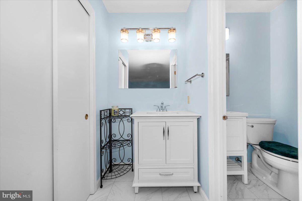 2614 Apple Way Dunkirk, MD 20754 - Photo 21 of 54 a bathroom with a sink a toilet and a mirror