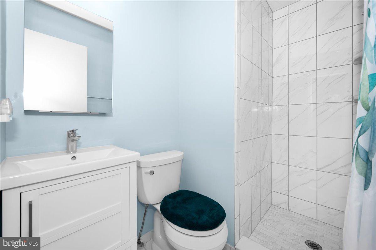 2614 Apple Way Dunkirk, MD 20754 - Photo 22 of 54 a bathroom with a sink a toilet and a mirror