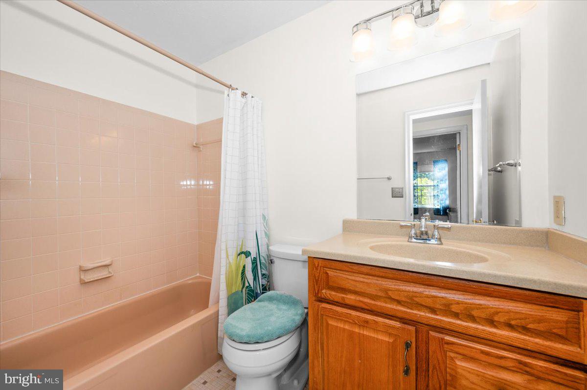 2614 Apple Way Dunkirk, MD 20754 - Photo 29 of 54 a bathroom with a granite countertop sink toilet and shower