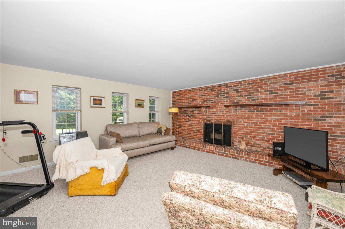 2614 Apple Way Dunkirk, MD 20754 - Photo 30 of 54 a living room with furniture and a fireplace