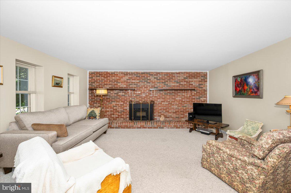 2614 Apple Way Dunkirk, MD 20754 - Photo 31 of 54 a living room with furniture a fireplace and a flat screen tv