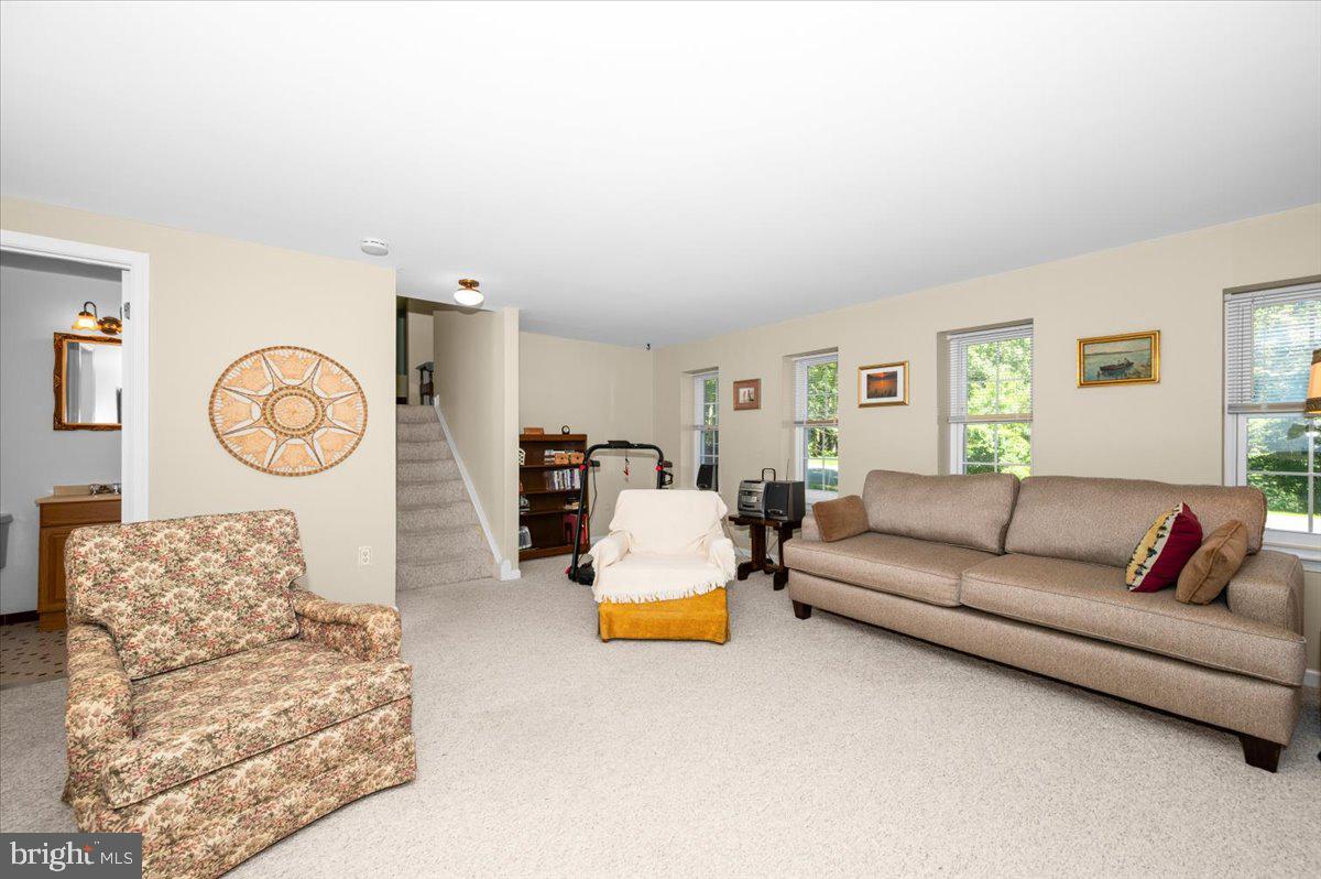 2614 Apple Way Dunkirk, MD 20754 - Photo 33 of 54 a living room with couch and a chandelier