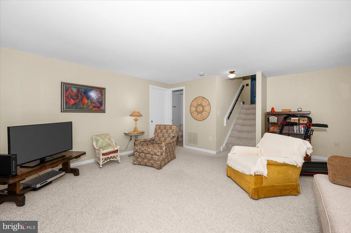 2614 Apple Way Dunkirk, MD 20754 - Photo 35 of 54 a living room with furniture and a flat screen tv