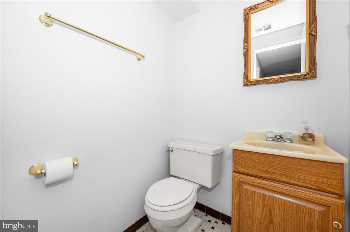 2614 Apple Way Dunkirk, MD 20754 - Photo 36 of 54 a bathroom with a toilet sink and mirror