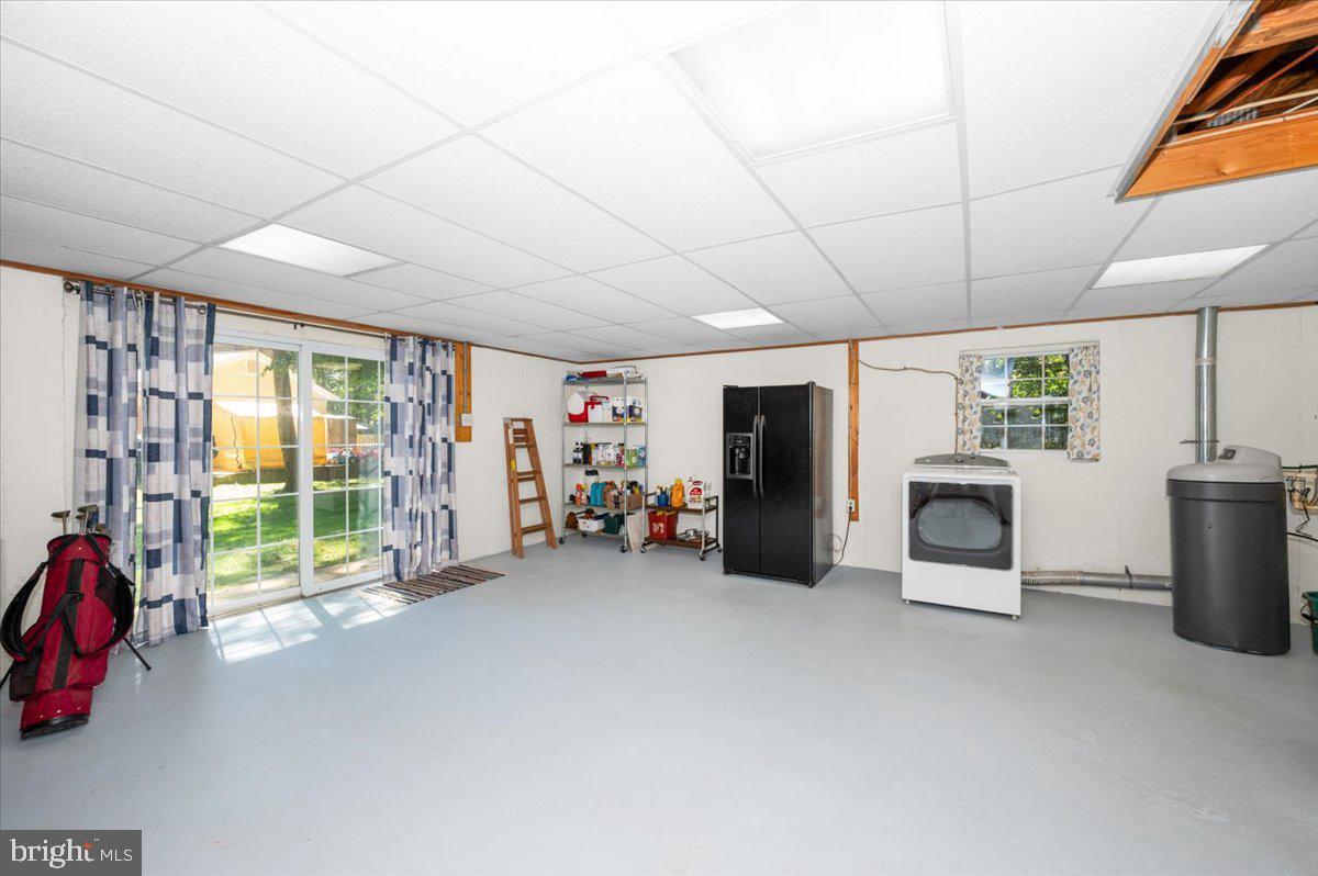 2614 Apple Way Dunkirk, MD 20754 - Photo 37 of 54 a view of a livingroom with furniture and a garage