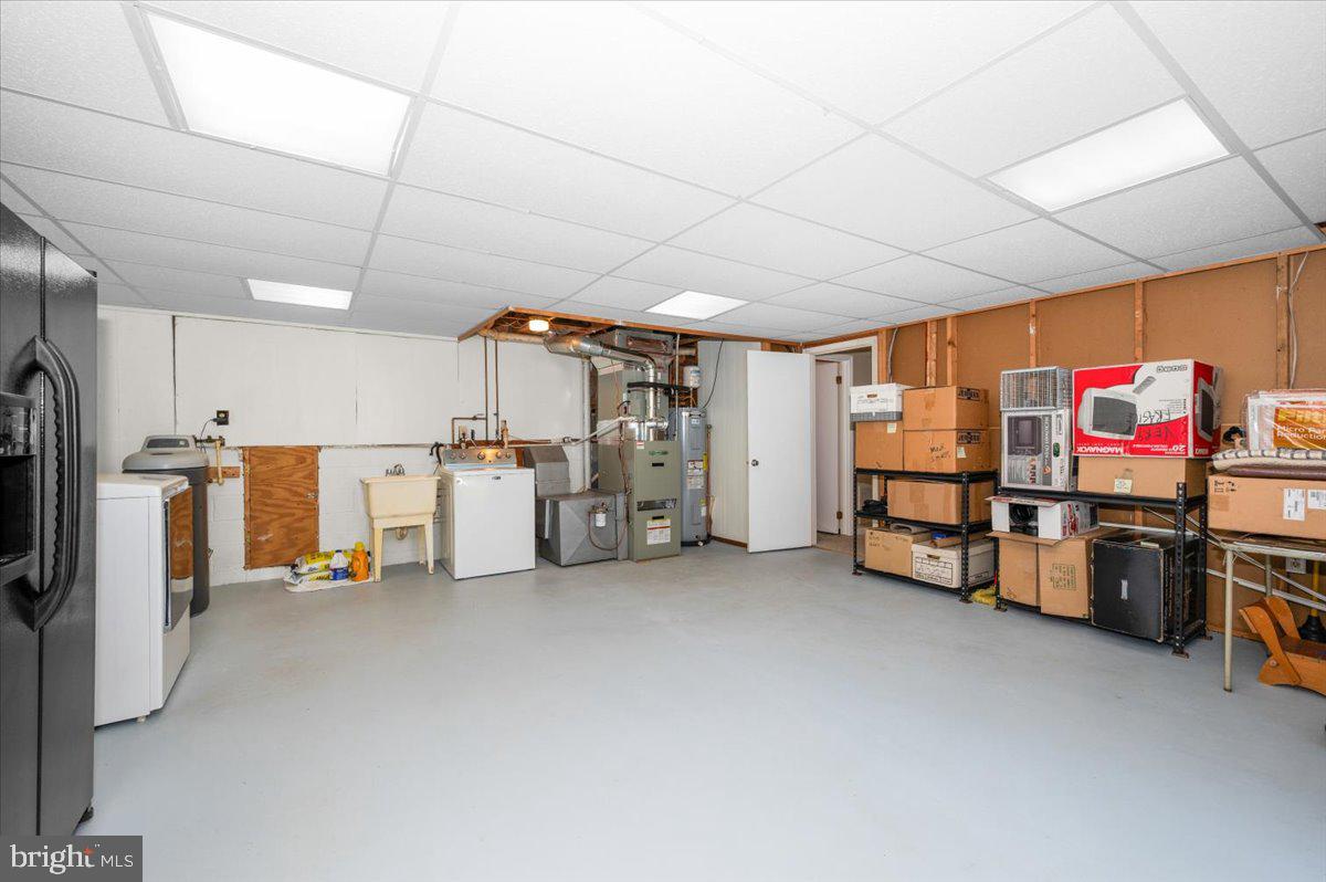 2614 Apple Way Dunkirk, MD 20754 - Photo 38 of 54 a storage room with stainless steel appliances kitchen island lots of white furniture