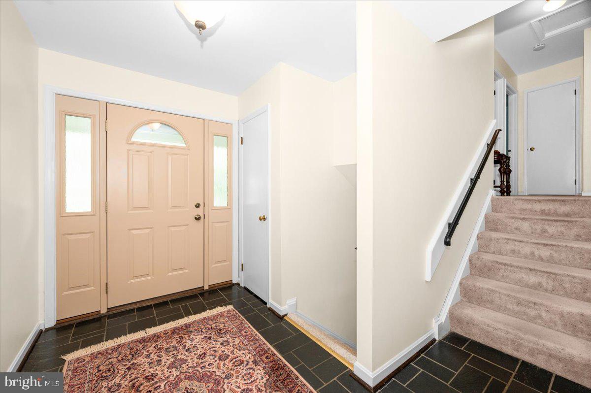 2614 Apple Way Dunkirk, MD 20754 - Photo 4 of 54 a view of a hallway with wooden floor and entryway