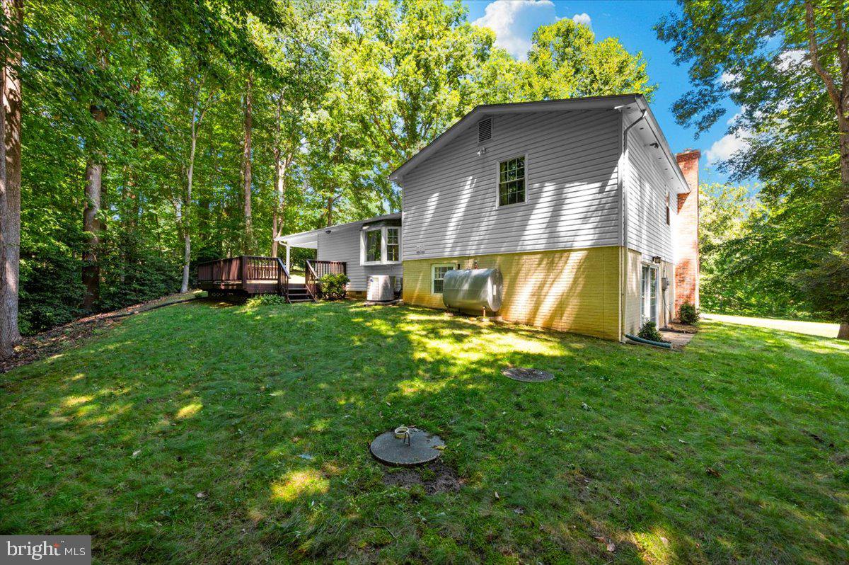 2614 Apple Way Dunkirk, MD 20754 - Photo 47 of 54 a view of backyard of house with wooden fence and trees