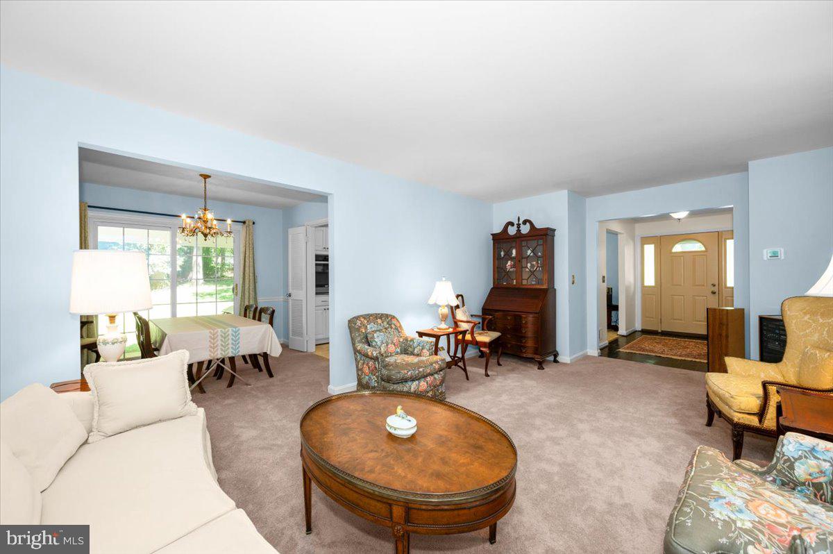 2614 Apple Way Dunkirk, MD 20754 - Photo 6 of 54 a living room with furniture a fireplace and large windows