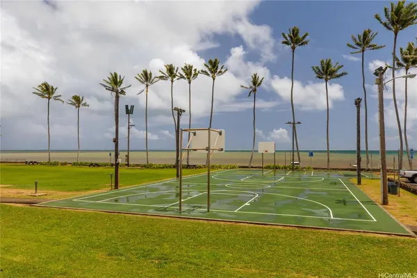 a view of a swimming pool with a lawn chairs