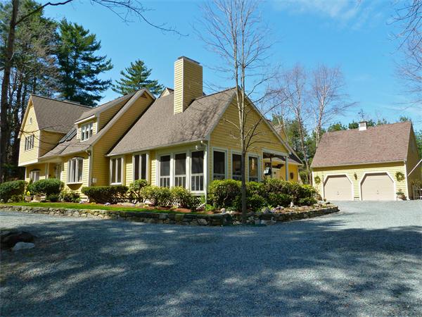 41 Forest Street Sherborn, MA 01770 - Photo 3 of 30 a front view of a house with a yard