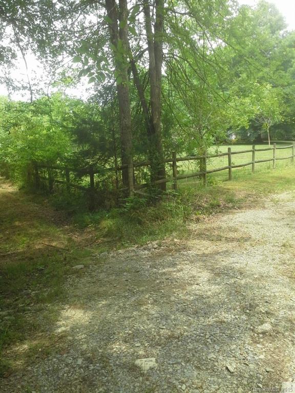 18517 Barnhardt Road Cornelius, NC 28031 - Photo 4 of 4 a view of a green yard with trees