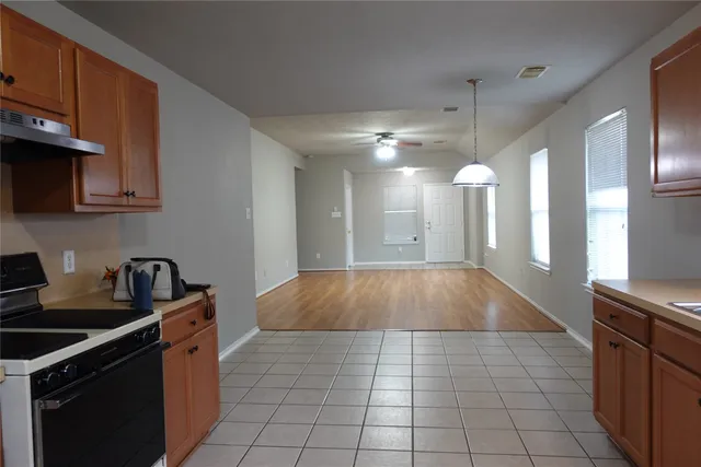 a room with lots of appliances and cabinets