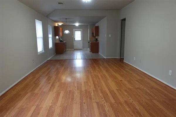 a view of gallery with wooden floor