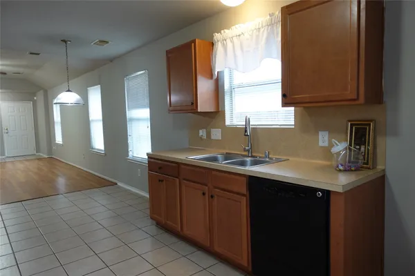a kitchen with a sink and cabinets