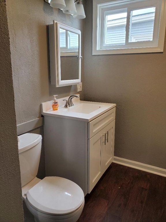 762 Globe Street, Unit 2 Fall River, MA 02724 - Photo 14 of 20 a bathroom with a toilet sink and mirror