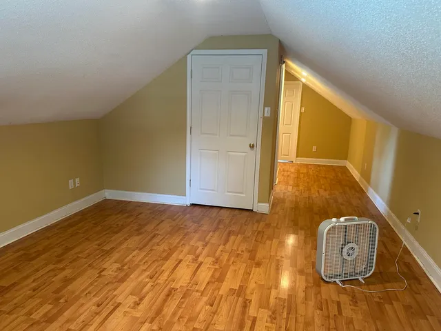 a view of a livingroom with wooden floor