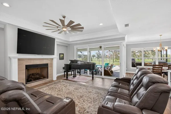 a kitchen with a white center island appliances and cabinets