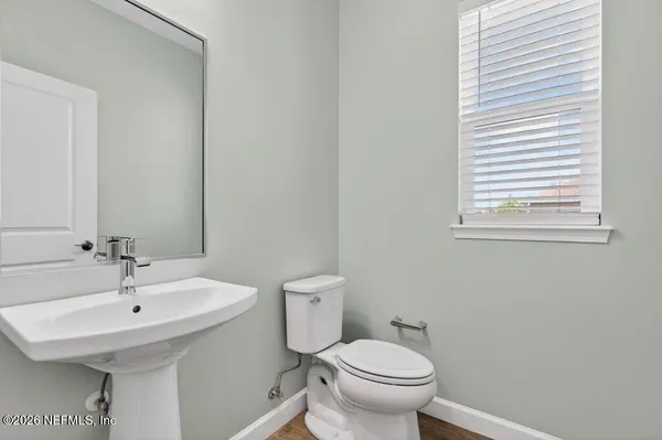a spacious bathroom with a granite countertop sink a toilet and shower