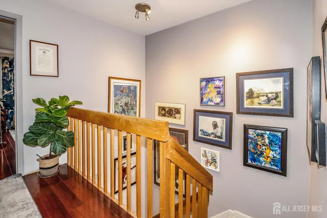 a view of a living room and wooden floor