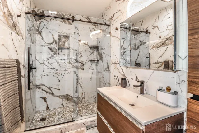 a bathroom with a sink and a mirror