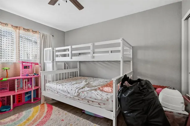 a bedroom with a bed and a book shelf