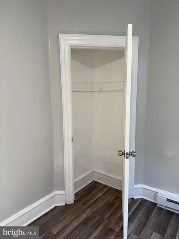 an empty room with wooden floor